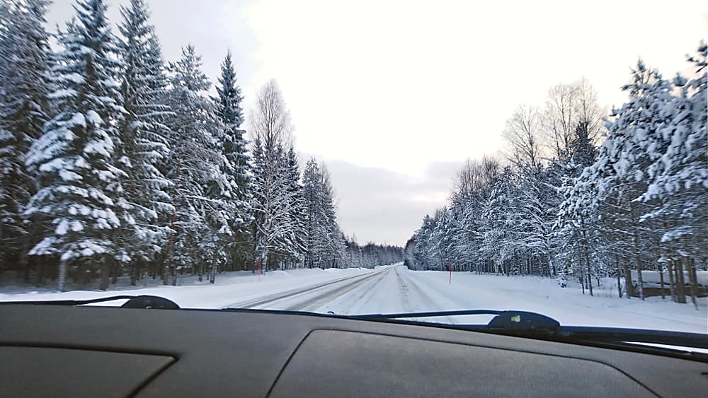 Driving safely down a snow covered road